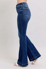 Blue flared jeans on a white background