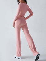 Person wearing a pink athletic outfit on a plain background