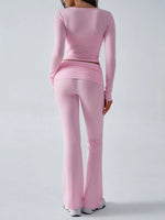 Person wearing a pink athletic outfit on a white background