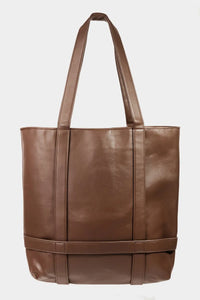 Brown leather tote bag on a white background