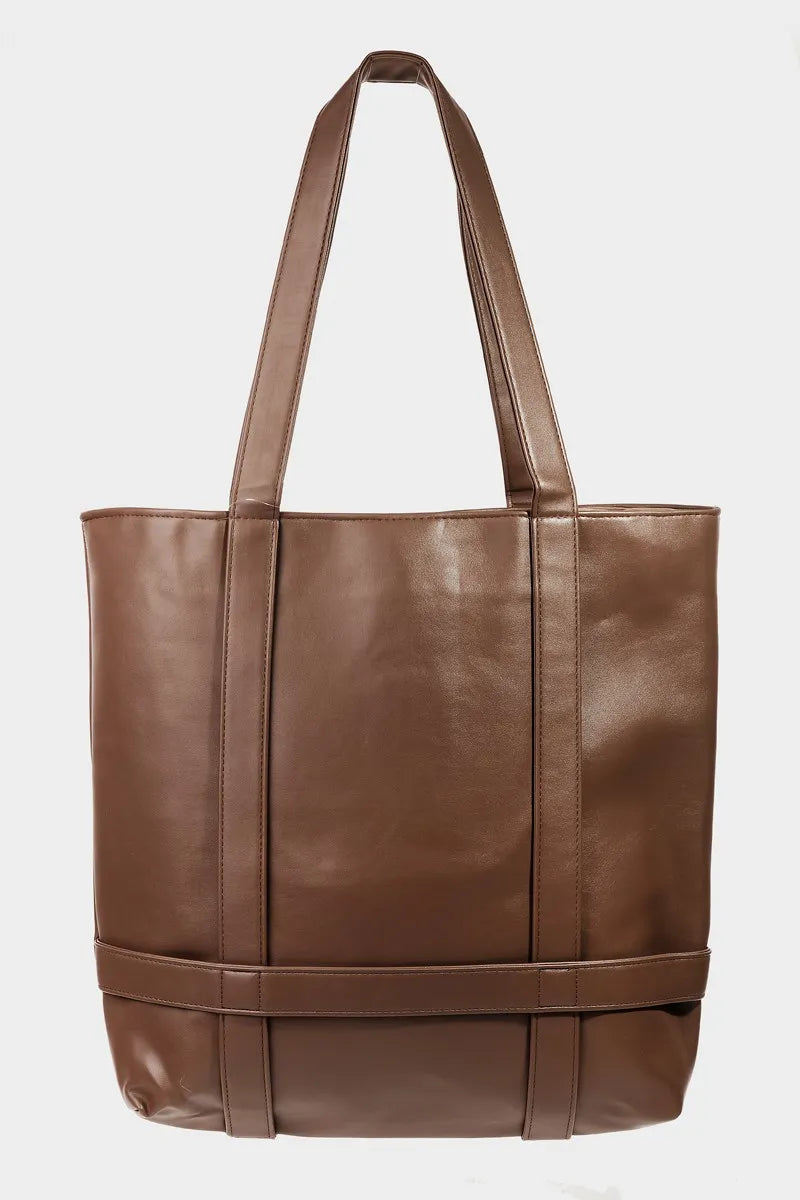 Brown leather tote bag on a white background