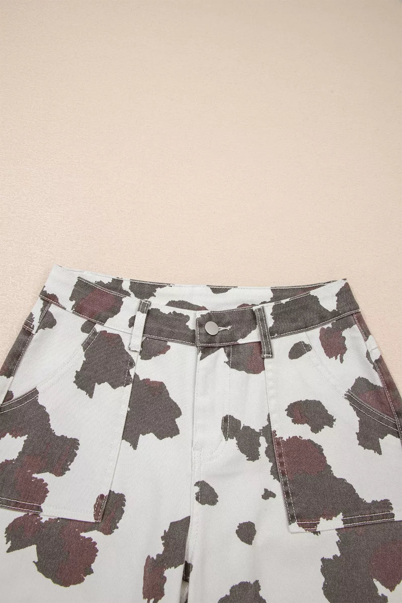 Cow print shorts on a beige background