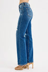 Blue jeans worn by a person on a white background