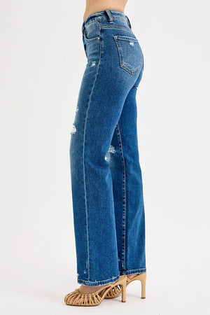 Blue jeans worn by a person on a white background
