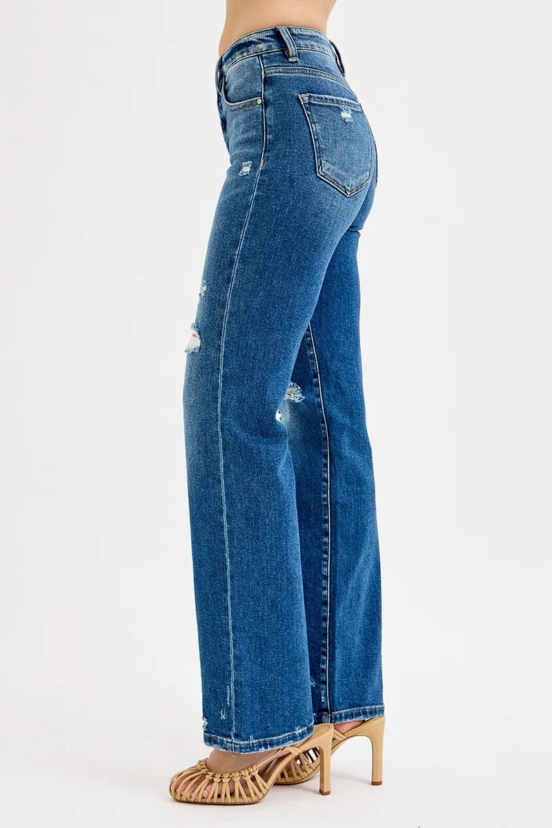 Blue jeans worn by a person on a white background