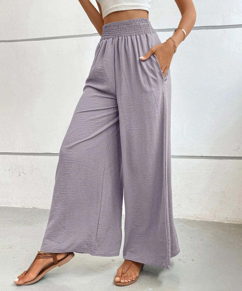 Person wearing light purple wide-leg pants against a white background