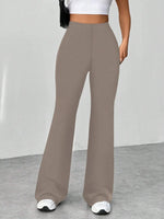 Brown wide-leg pants worn by a person on a plain background