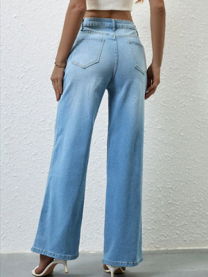 Light blue wide-leg jeans worn by a person on a light gray background