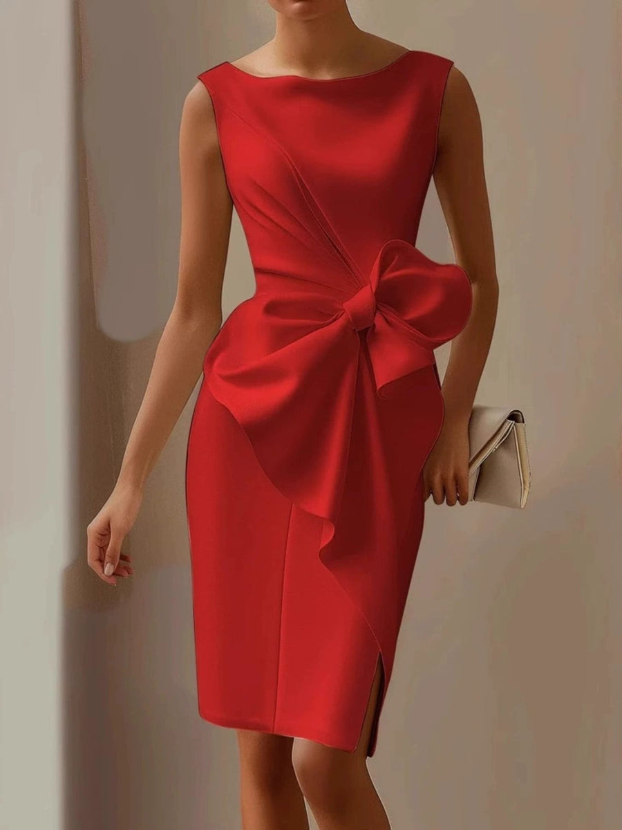Red dress with a large bow detail on a plain background