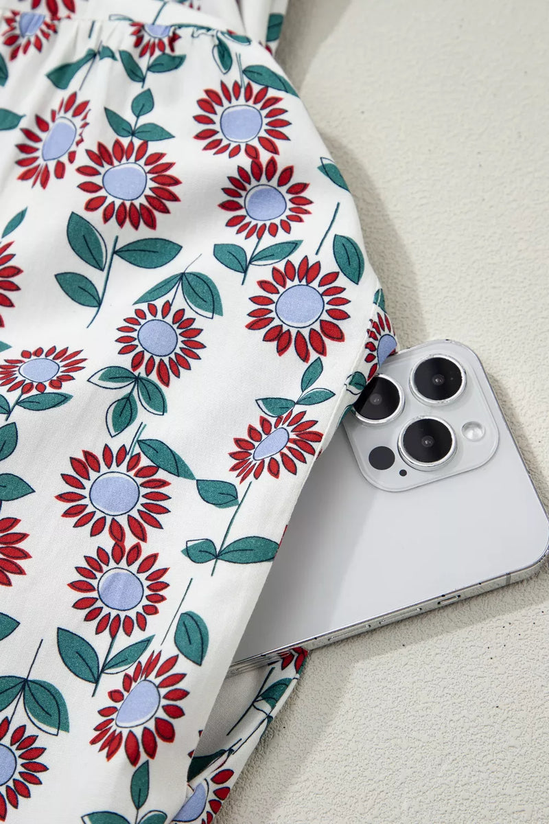 Floral-patterned fabric with a smartphone on a light background