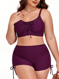 Woman wearing a purple bikini set on a white background