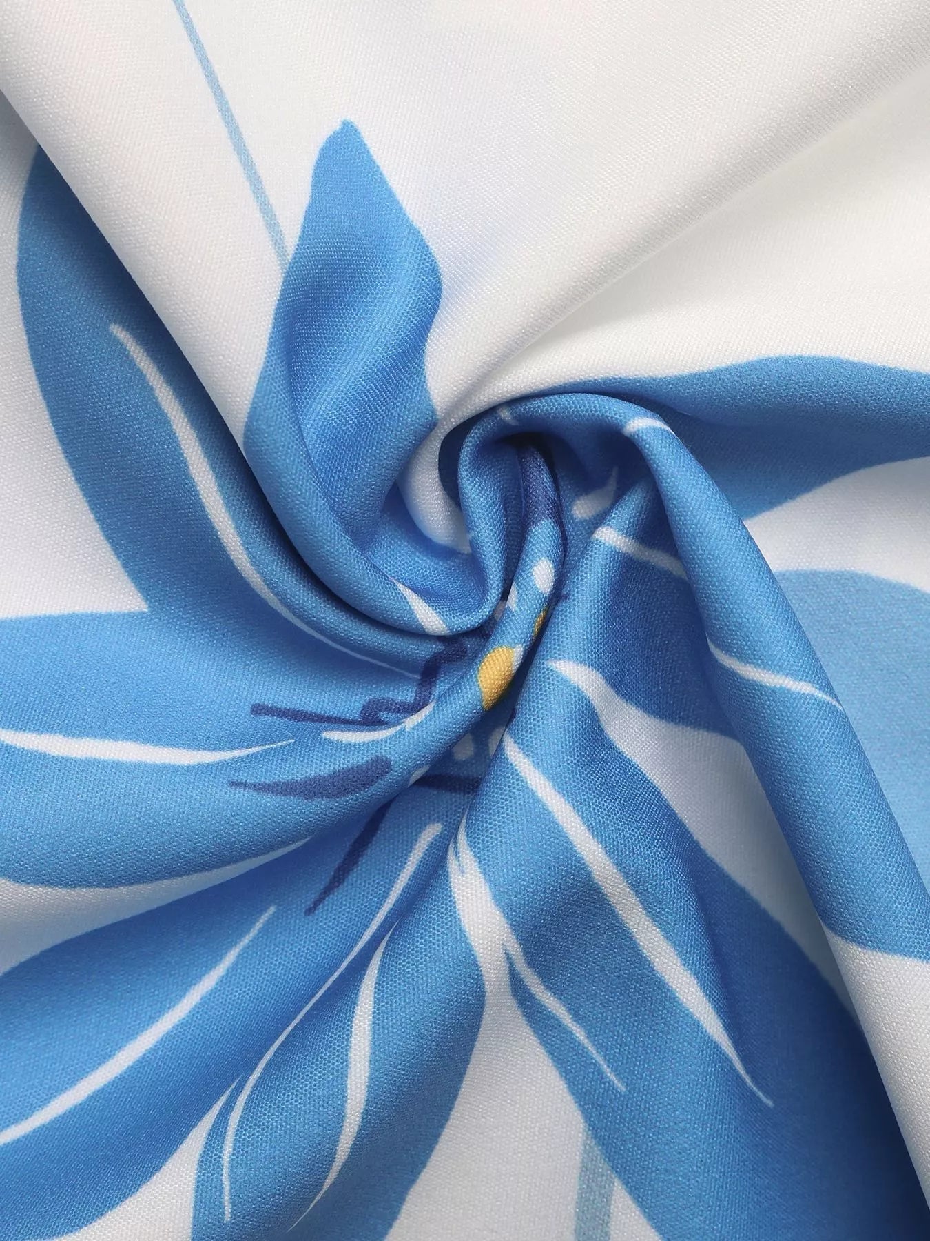 Close-up of blue and white fabric with floral pattern