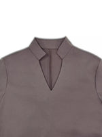 Gray sleeveless top with a collar on a white background