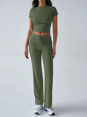 Person wearing a green athletic outfit on a white background