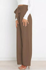 Brown wide-leg pants with a tie waist worn by a person on a white background