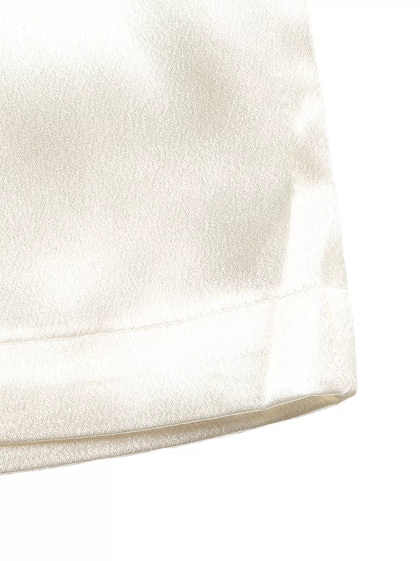 Close-up of a textured white fabric surface