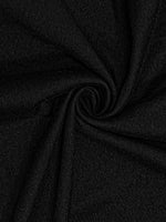 Close-up of dark gray fabric with a slight texture