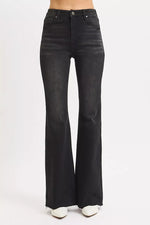 Black flared jeans on a white background