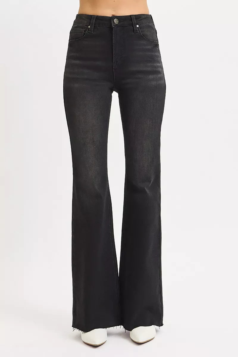 Black flared jeans on a white background