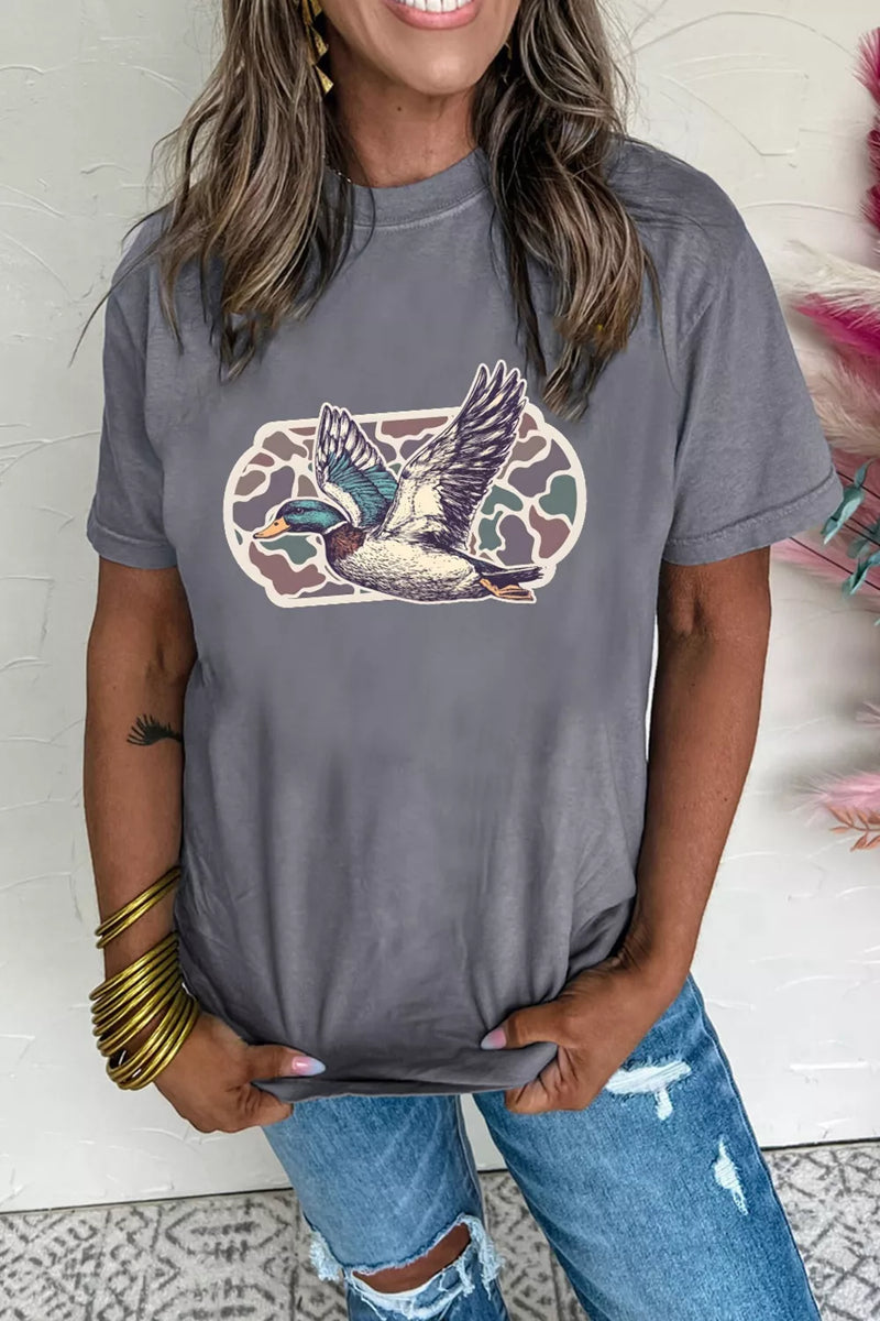 Woman wearing a gray t-shirt with a duck graphic design.