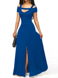 Woman wearing a blue evening gown with cut-out shoulders and a high slit on a white background