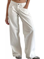 A person wearing off-white wide-leg denim jeans with a relaxed, straight-to-slightly-curved leg fit, paired with gray sneakers against a plain white background.