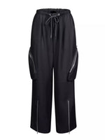 Black wide-leg cargo pants with a drawstring waist, side zip pockets, and zippered ankle details, shown against a plain white background.
