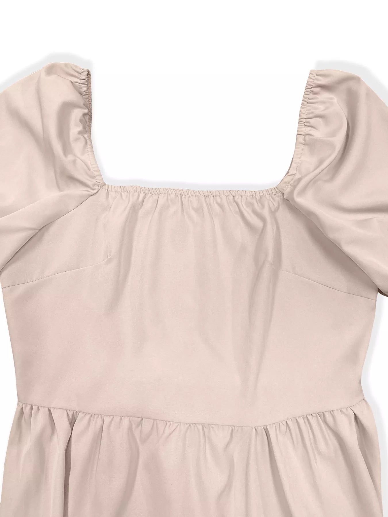 Beige dress with puff sleeves on a white background