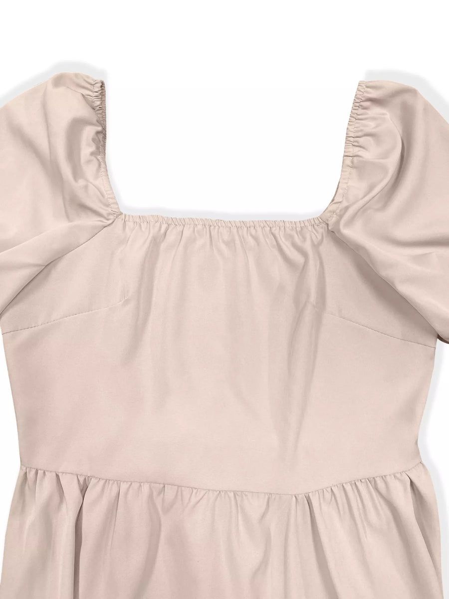 Beige dress with puff sleeves on a white background