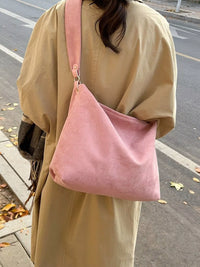 Woman carrying Women's Suede Hobo Shoulder Bag over her shoulder
