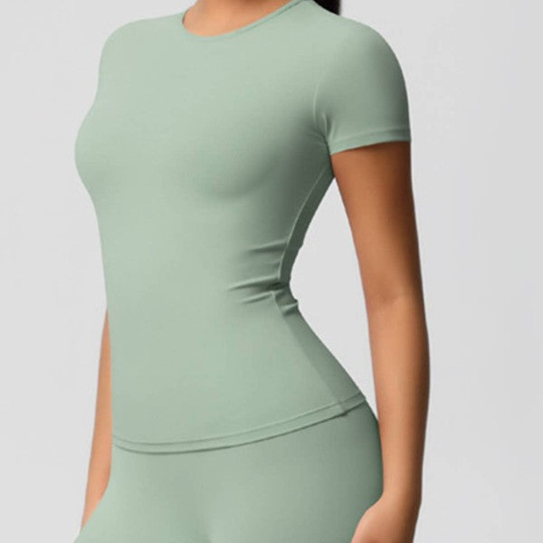 Light green athletic outfit on a plain background