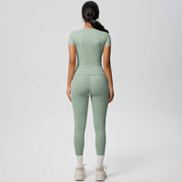 Person wearing a green jumpsuit on a white background