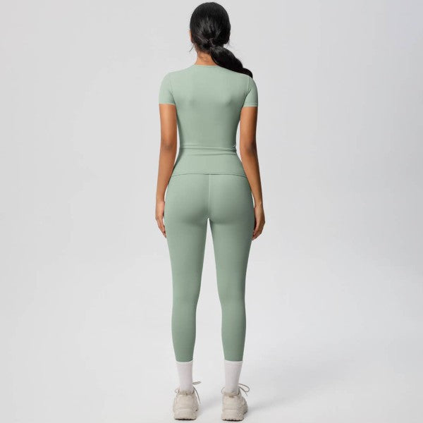 Person wearing a green jumpsuit on a white background