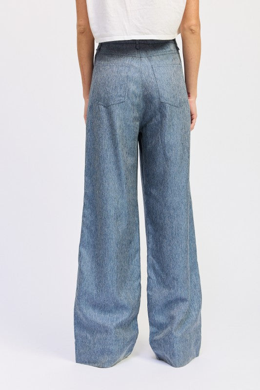 Wide-leg jeans worn by a person on a white background