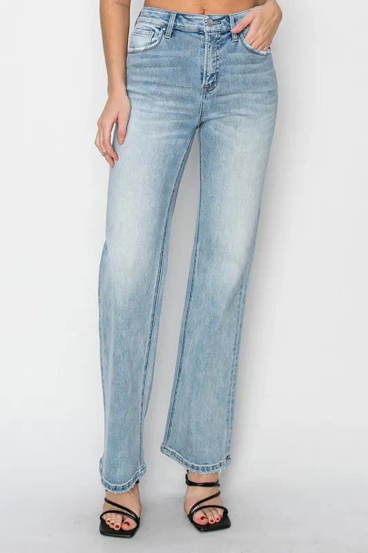 Light blue jeans worn by a person on a white background
