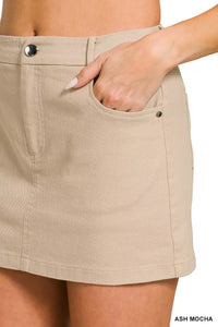 Beige skirt with a hand in the pocket on a white background