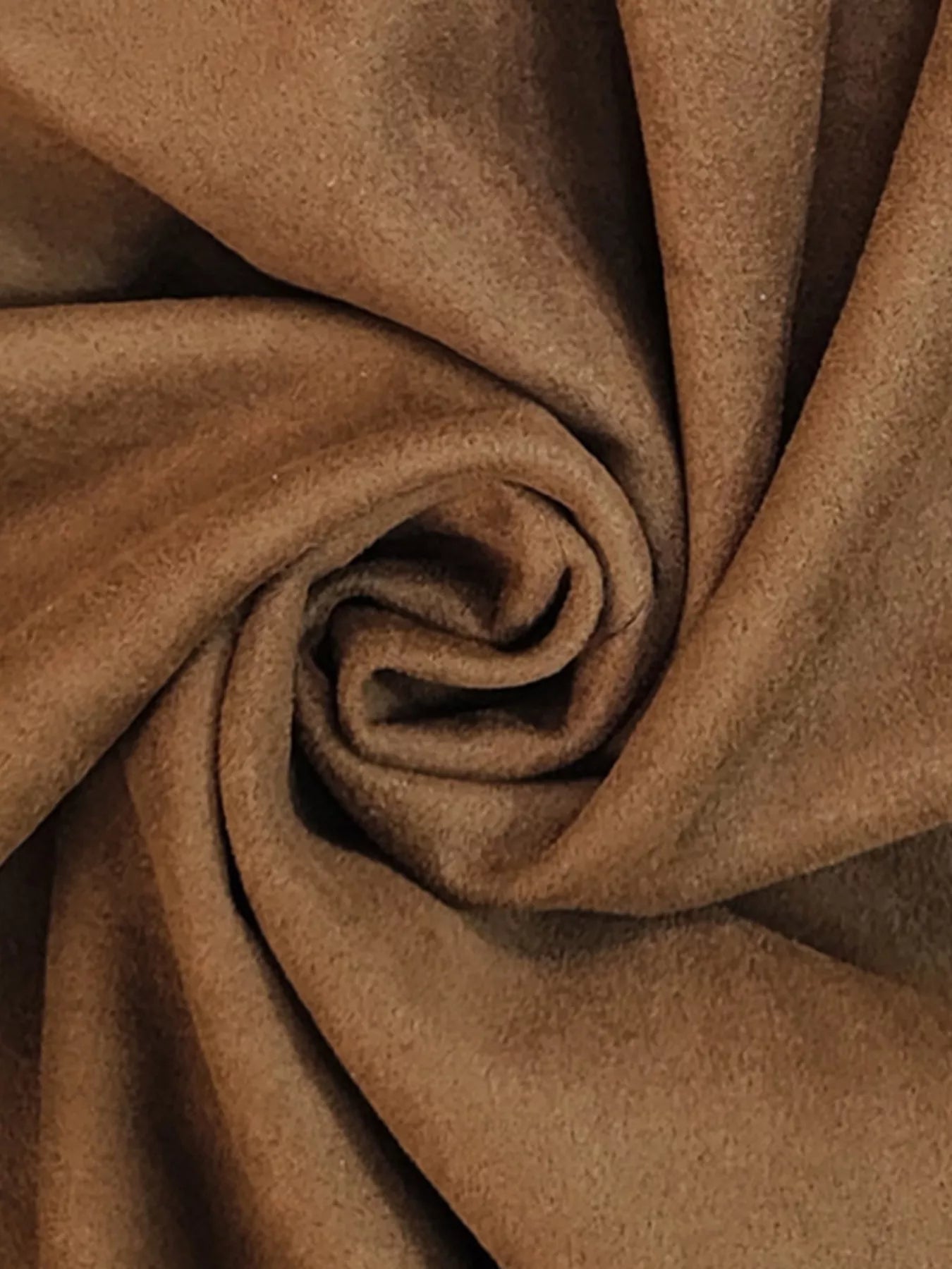 Close-up of brown fabric with a swirl pattern