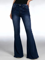 Blue flared jeans worn by a person on a white background
