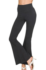 Black wide-leg pants worn by a person on a white background