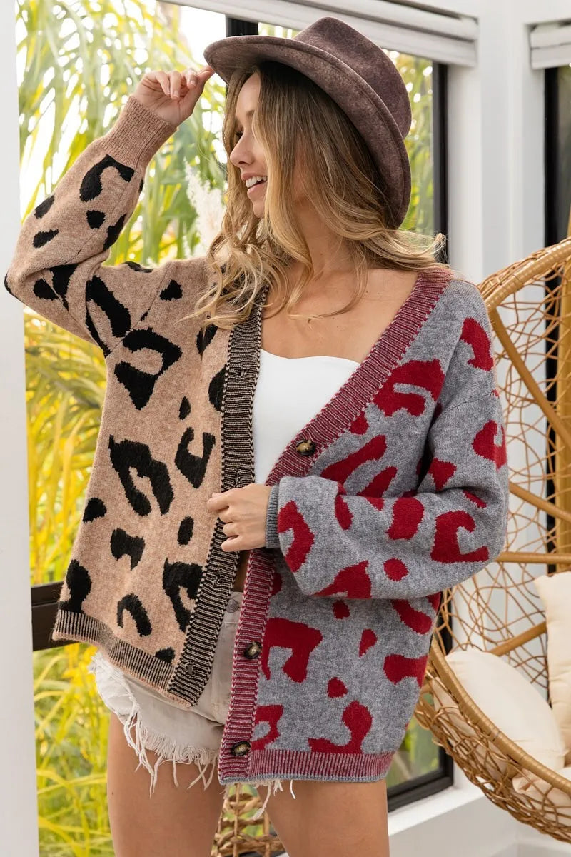 Woman wearing a patterned cardigan with a blurred outdoor background