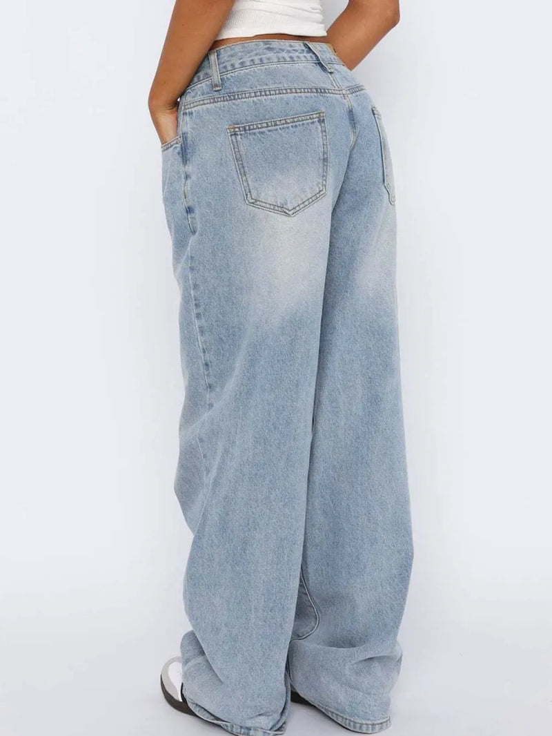 Light blue jeans worn by a person on a white background