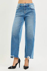 Blue jeans worn by a person on a white background
