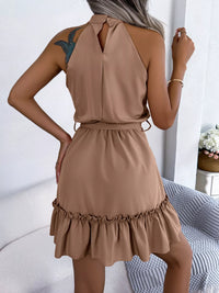 Woman wearing a brown dress with a white background