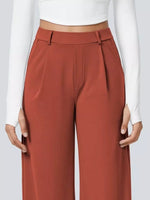 Brown pants worn by a person on a white background