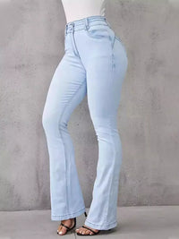 Light blue jeans worn by a person on a gray background