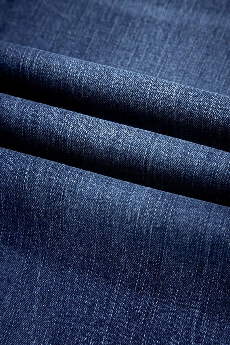 Close-up of blue denim fabric with a textured pattern