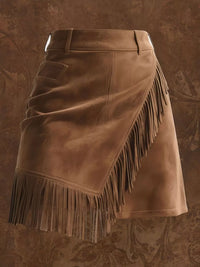 Brown leather skirt with fringe on a textured brown background