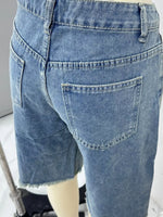 Blue denim shorts on a mannequin against a neutral background