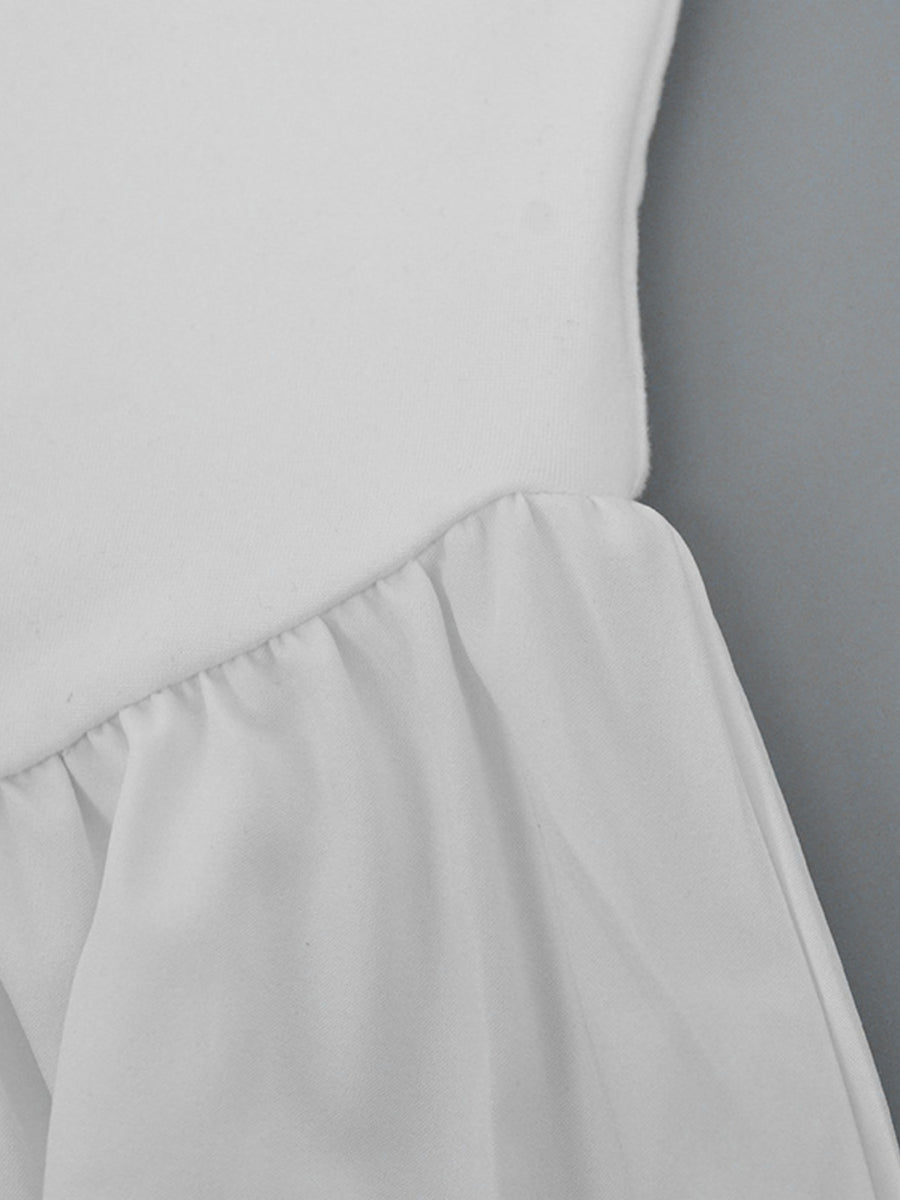 Light gray dress with a plain background