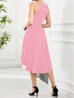 Pink one-shoulder dress worn by a person on a white background